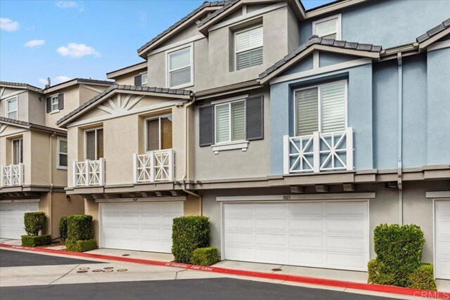 3023 Pacific Palm Way, San Diego, CA 92117 - multi unit property featuring stucco siding and an attached garage