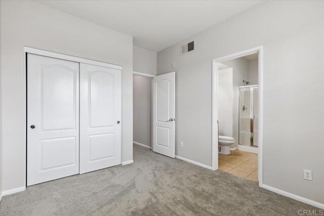 3023 Pacific Palm Way, San Diego, CA 92117 - unfurnished bedroom featuring a closet, carpet floors, ensuite bath, and tile patterned flooring