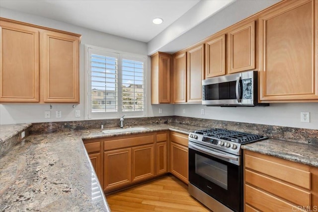 3023 Pacific Palm Way, San Diego, CA 92117 - kitchen featuring appliances with stainless steel finishes, light wood-type flooring, stone countertops, and recessed lighting