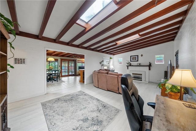 2324 Manchester Ave, Cardiff By The Sea, CA 92007 - home office with light wood-type flooring, a brick fireplace, and a skylight