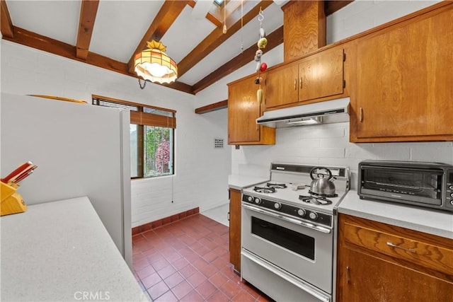 2324 Manchester Ave, Cardiff By The Sea, CA 92007 - kitchen with white gas range, under cabinet range hood, light countertops, brown cabinetry, and dark tile patterned floors