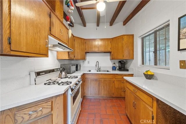 2324 Manchester Ave, Cardiff By The Sea, CA 92007 - kitchen with white gas range, under cabinet range hood, a sink, beam ceiling, and brown cabinetry
