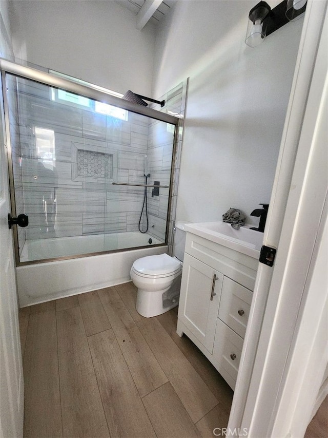 18623 11th St, Bloomington, CA 92316 - full bathroom with vanity, toilet, combined bath / shower with glass door, and wood finished floors