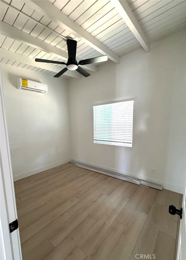 18623 11th St, Bloomington, CA 92316 - empty room featuring a wall unit AC, wood finished floors, baseboards, ceiling fan, and wood ceiling with exposed beams