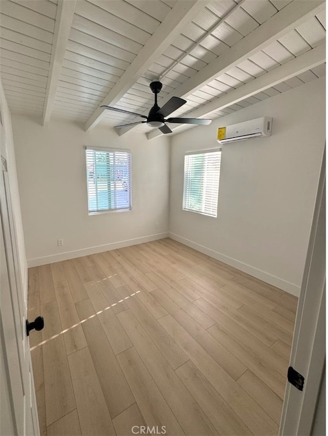 18623 11th St, Bloomington, CA 92316 - unfurnished room with a wall unit AC, plenty of natural light, beamed ceiling, and baseboards