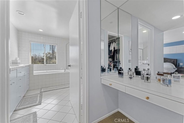 17426 Flanders St, Granada Hills, CA 91344 - bathroom with vanity, a bath, tile patterned flooring, recessed lighting, and a walk in closet