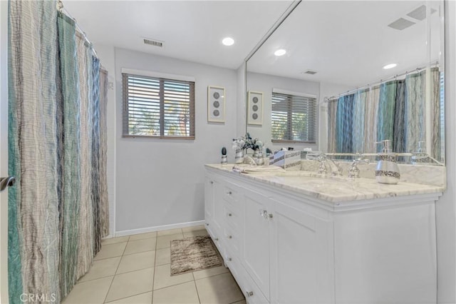 17426 Flanders St, Granada Hills, CA 91344 - full bath featuring double vanity, healthy amount of natural light, tile patterned flooring, baseboards, and recessed lighting