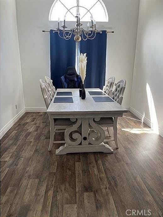 37713 57th St E, Palmdale, CA 93552 - dining space featuring a chandelier, wood finished floors, and baseboards