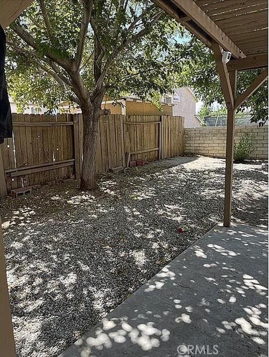 37713 57th St E, Palmdale, CA 93552 - fenced backyard featuring a pergola and a patio area