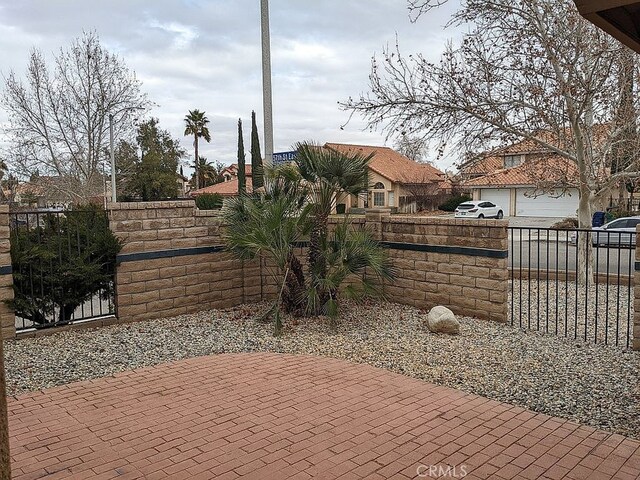 37713 57th St E, Palmdale, CA 93552 - view of patio / terrace with a garage