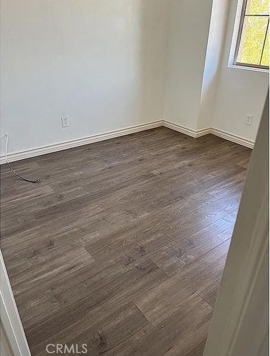 37713 57th St E, Palmdale, CA 93552 - unfurnished room featuring dark wood finished floors and baseboards