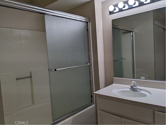 37713 57th St E, Palmdale, CA 93552 - bathroom with vanity and bath / shower combo with glass door