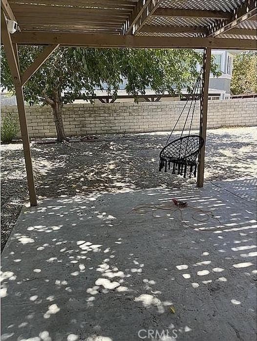 37713 57th St E, Palmdale, CA 93552 - fenced backyard with a pergola