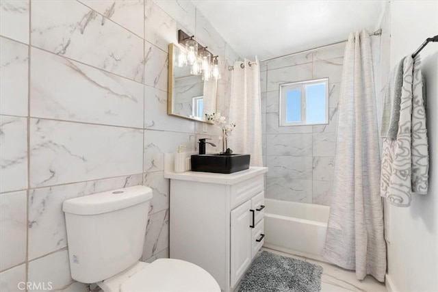 12074 Lee Ave, Adelanto, CA 92301 - full bathroom featuring vanity, tile walls, shower / tub combo, and toilet
