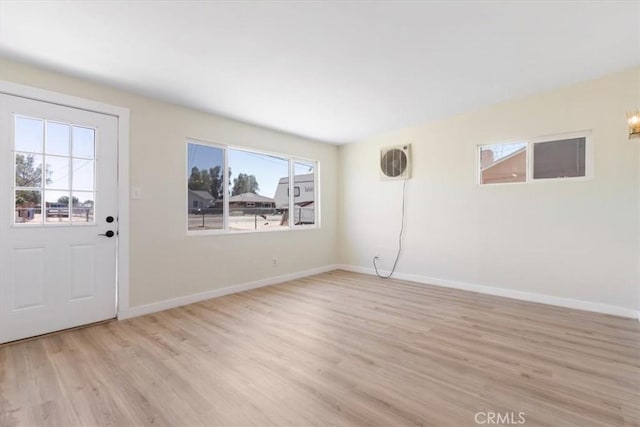 12074 Lee Ave, Adelanto, CA 92301 - foyer entrance with light wood-style floors and baseboards