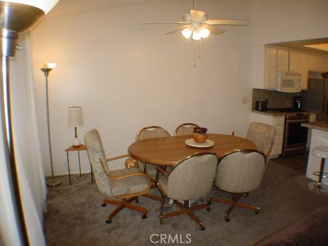 1412 Colonial Way, San Jacinto, CA 92583 - dining room featuring a ceiling fan and dark colored carpet