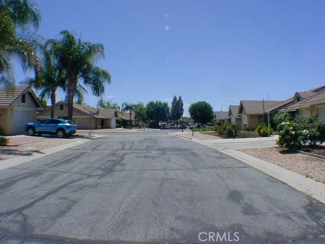 1412 Colonial Way, San Jacinto, CA 92583 - view of asphalt street with a residential view and curbs