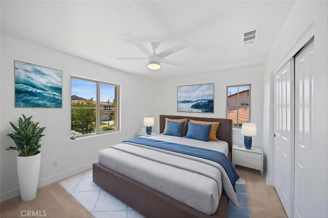 34090 Lady Fern Ct, Lake Elsinore, CA 92532 - bedroom with a closet, light carpet, baseboards, and ceiling fan