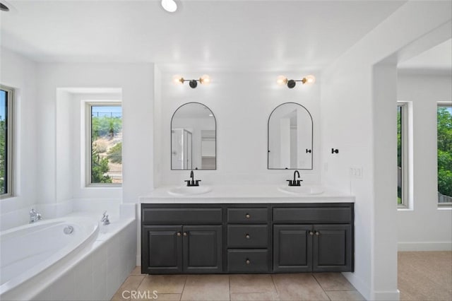 34090 Lady Fern Ct, Lake Elsinore, CA 92532 - bathroom with double vanity, a garden tub, and tile patterned floors