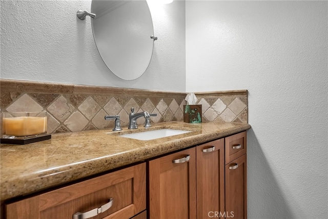 1205 S Catalina Ave S Unit A, Redondo Beach, CA 90277 - bathroom featuring vanity, a textured wall, and backsplash