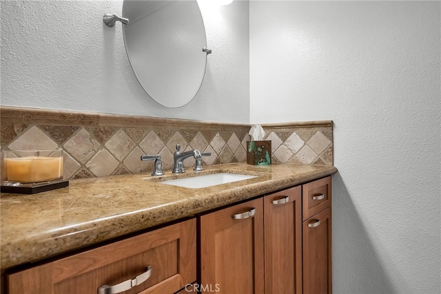 1205 S Catalina Ave S Unit A, Redondo Beach, CA 90277 - bathroom with vanity, a textured wall, and backsplash