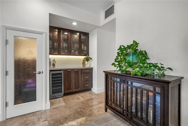 1205 S Catalina Ave S Unit A, Redondo Beach, CA 90277 - indoor dry bar with wine cooler, ornamental molding, light stone finish flooring, and baseboards