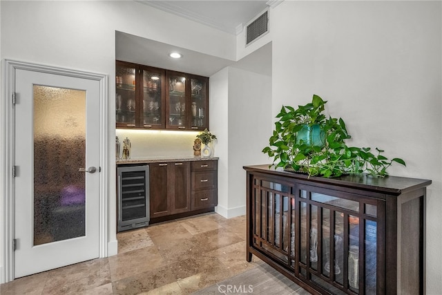 1205 S Catalina Ave S Unit A, Redondo Beach, CA 90277 - indoor dry bar featuring beverage cooler, crown molding, and stone tile flooring