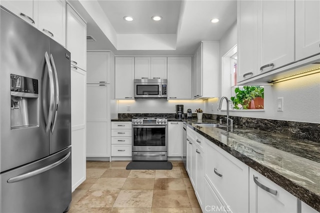 1205 S Catalina Ave S Unit A, Redondo Beach, CA 90277 - kitchen with stainless steel appliances, a sink, a raised ceiling, white cabinetry, and recessed lighting