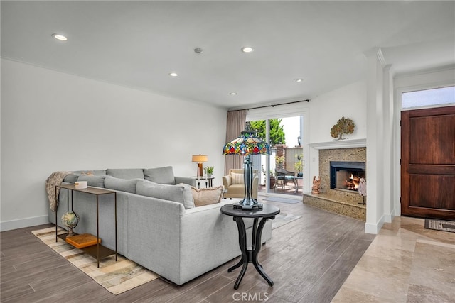 1205 S Catalina Ave S Unit A, Redondo Beach, CA 90277 - living area with a premium fireplace, wood finished floors, recessed lighting, baseboards, and crown molding
