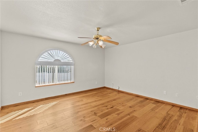 13209 Richmond Way, Apple Valley, CA 92308 - unfurnished room featuring light wood-style flooring, a ceiling fan, and baseboards
