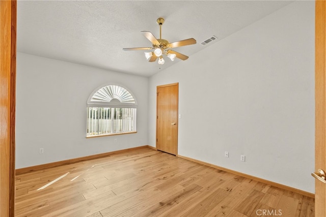 13209 Richmond Way, Apple Valley, CA 92308 - empty room featuring a ceiling fan, light wood-type flooring, vaulted ceiling, and baseboards