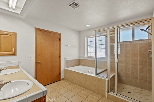 13209 Richmond Way, Apple Valley, CA 92308 - full bath with a shower stall, a bath, double vanity, tile patterned floors, and recessed lighting
