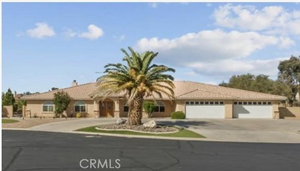 13209 Richmond Way, Apple Valley, CA 92308 - ranch-style home featuring concrete driveway and a garage