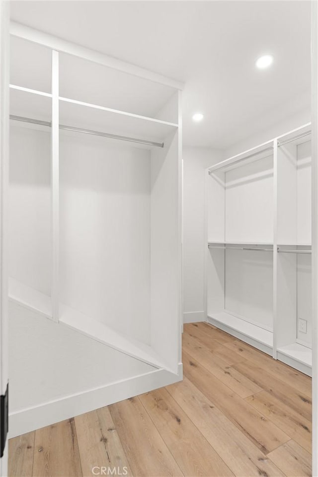 742 Hudson Ave, Costa Mesa, CA 92626 - walk in closet with light wood-style flooring