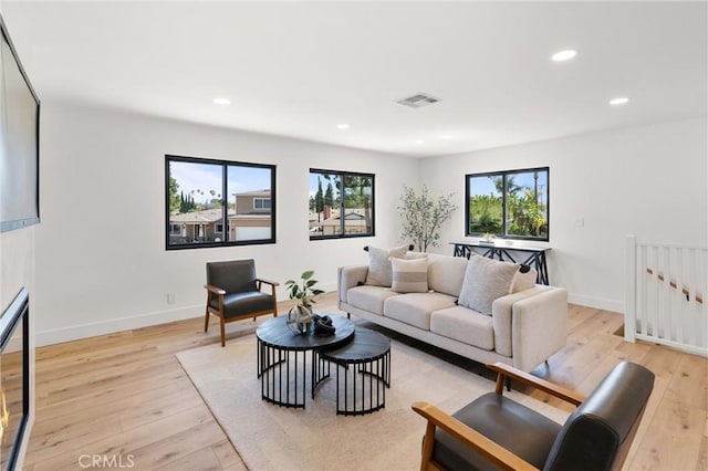 742 Hudson Ave, Costa Mesa, CA 92626 - living room with light wood finished floors, recessed lighting, and baseboards