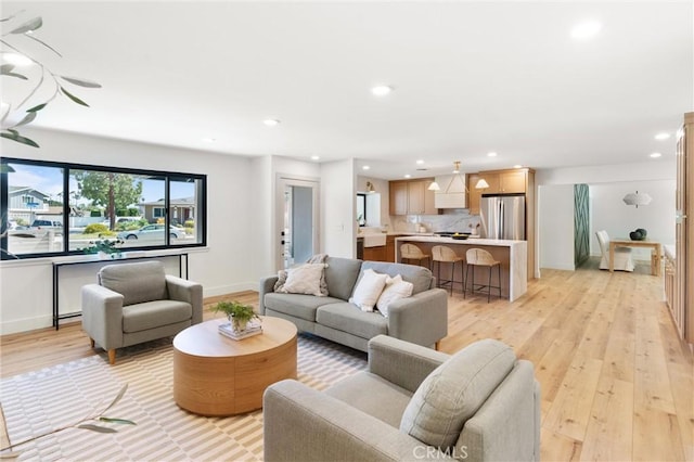 742 Hudson Ave, Costa Mesa, CA 92626 - living room featuring light wood-type flooring, recessed lighting, and baseboards