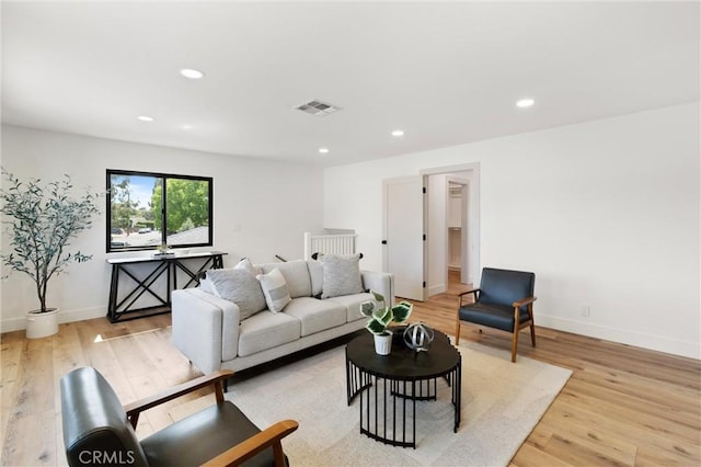 742 Hudson Ave, Costa Mesa, CA 92626 - living room with light wood-type flooring, recessed lighting, and baseboards