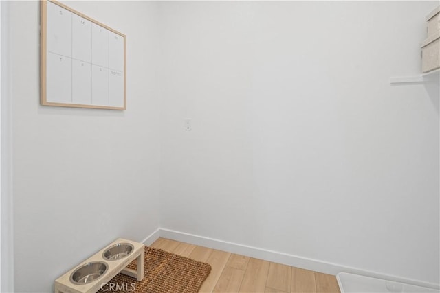 415 E 220th St, Carson, CA 90745 - laundry room featuring light wood finished floors and baseboards