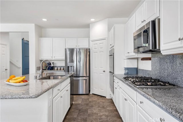 32172 Verbena Way, Temecula, CA 92591 - kitchen featuring appliances with stainless steel finishes, a sink, white cabinetry, and recessed lighting