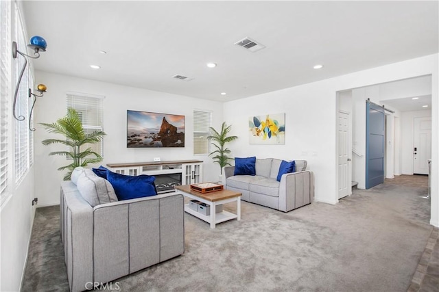 32172 Verbena Way, Temecula, CA 92591 - living area featuring a barn door, carpet flooring, recessed lighting, and baseboards