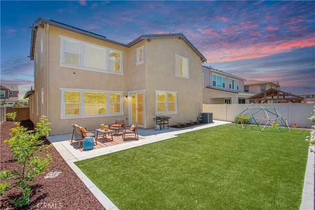 32172 Verbena Way, Temecula, CA 92591 - rear view of property with stucco siding, central AC, a patio, and an outdoor hangout area