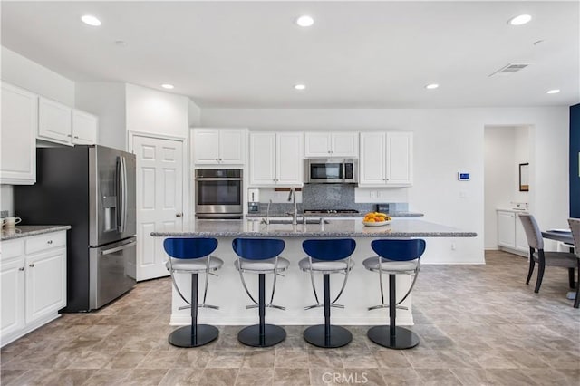 32172 Verbena Way, Temecula, CA 92591 - kitchen featuring appliances with stainless steel finishes, a sink, white cabinetry, and recessed lighting