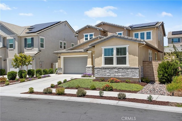 32172 Verbena Way, Temecula, CA 92591 - view of front of house featuring stone siding, concrete driveway, stucco siding, and roof mounted solar panels