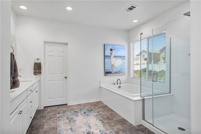 32172 Verbena Way, Temecula, CA 92591 - bathroom with a garden tub, vanity, recessed lighting, and a stall shower