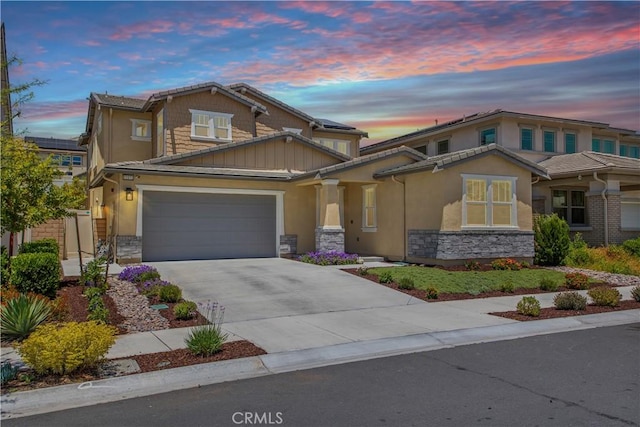 32172 Verbena Way, Temecula, CA 92591 - view of front of home featuring stone siding, concrete driveway, and stucco siding