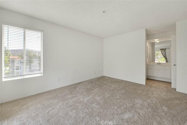 1995 Las Colinas Cir Unit 307, Corona, CA 92879 - carpeted empty room featuring a textured ceiling