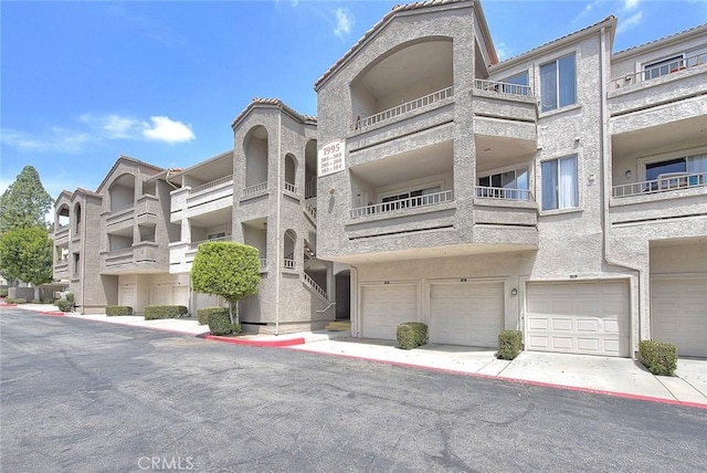 1995 Las Colinas Cir Unit 307, Corona, CA 92879 - view of apartment building / complex with an attached garage