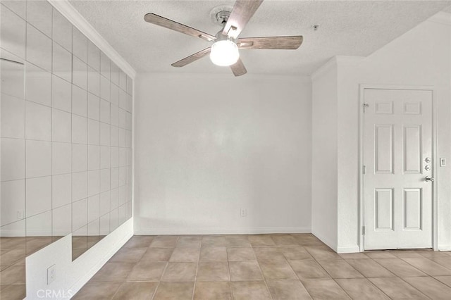 1995 Las Colinas Cir Unit 307, Corona, CA 92879 - spare room with ornamental molding, a textured ceiling, a ceiling fan, baseboards, and light tile patterned floors
