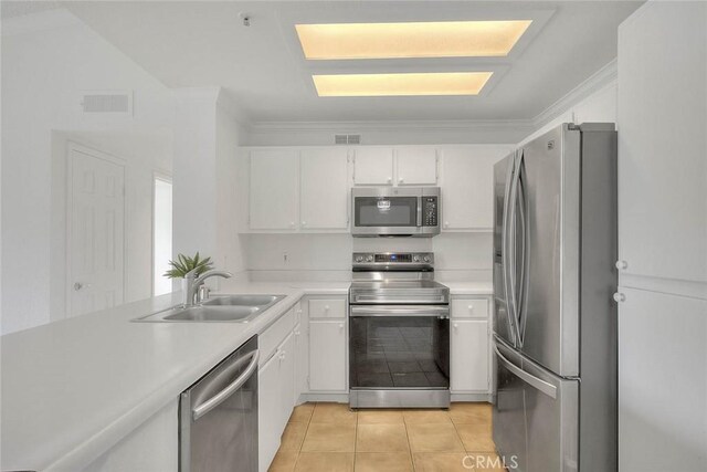 1995 Las Colinas Cir Unit 307, Corona, CA 92879 - kitchen featuring stainless steel appliances, a sink, white cabinets, light countertops, and light tile patterned floors