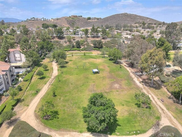 1995 Las Colinas Cir Unit 307, Corona, CA 92879 - aerial view of property's location with nearby suburban area and a mountainous background